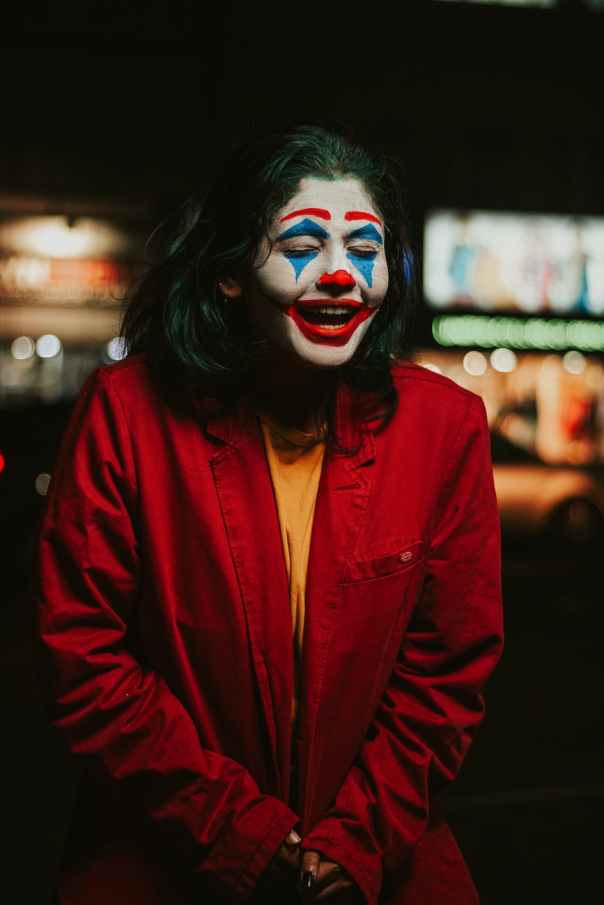 photo of person smiling with face paint
